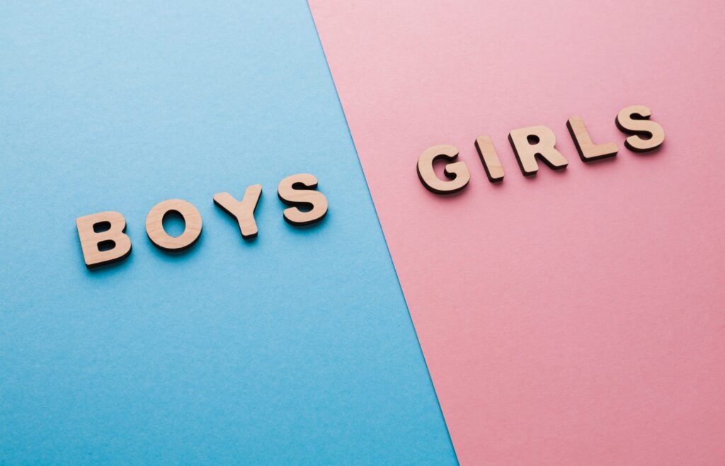 Photo of the words Boys and Girls on bright blue and pink backgrounds