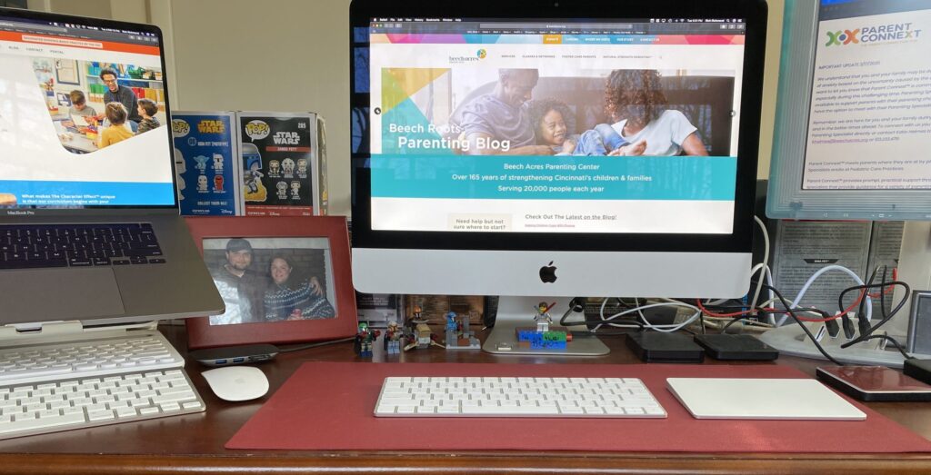 Photo of the BAPC website displayed on digital screens