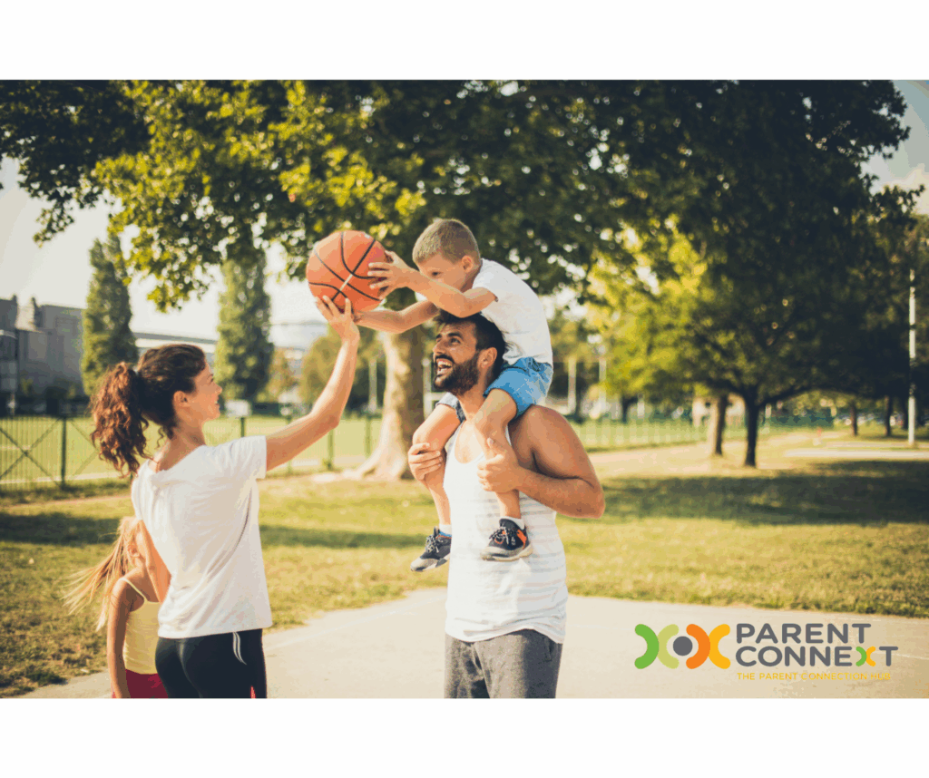 Photo of a family outside playing basketball together